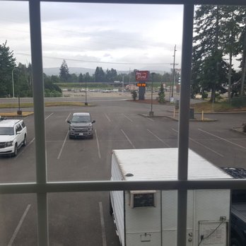 Stay Beyond Inn & Suites - View from our window. This the entrance and parking lot of hotel. Burger king is located a block away - Hotels Near Me - Elma, Washington