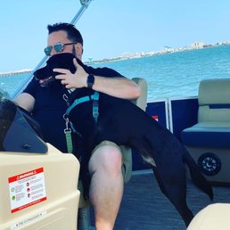 Our dog enjoying his first boat ride. Our dog enjoying his first boat ride.