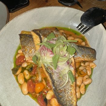 Itria - BRANZINO, CRUSHED FINGERLINGS, FAVA BEANS, SPRING ONION, SALSA VERDE - Italian Near Me - San Francisco, California Itria - BRANZINO, CRUSHED FINGERLINGS, FAVA BEANS, SPRING ONION, SALSA VERDE - Italian Near Me - San Francisco, California