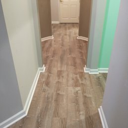 New vinyl in hallway - notice the insane number of angles. The installer did a great job of matching all it up nicely.