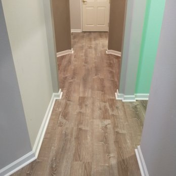 HŌM Solutions - New vinyl in hallway - notice the insane number of angles. The installer did a great job of matching all it up nicely. - Flooring Near Me - Denver, Colorado