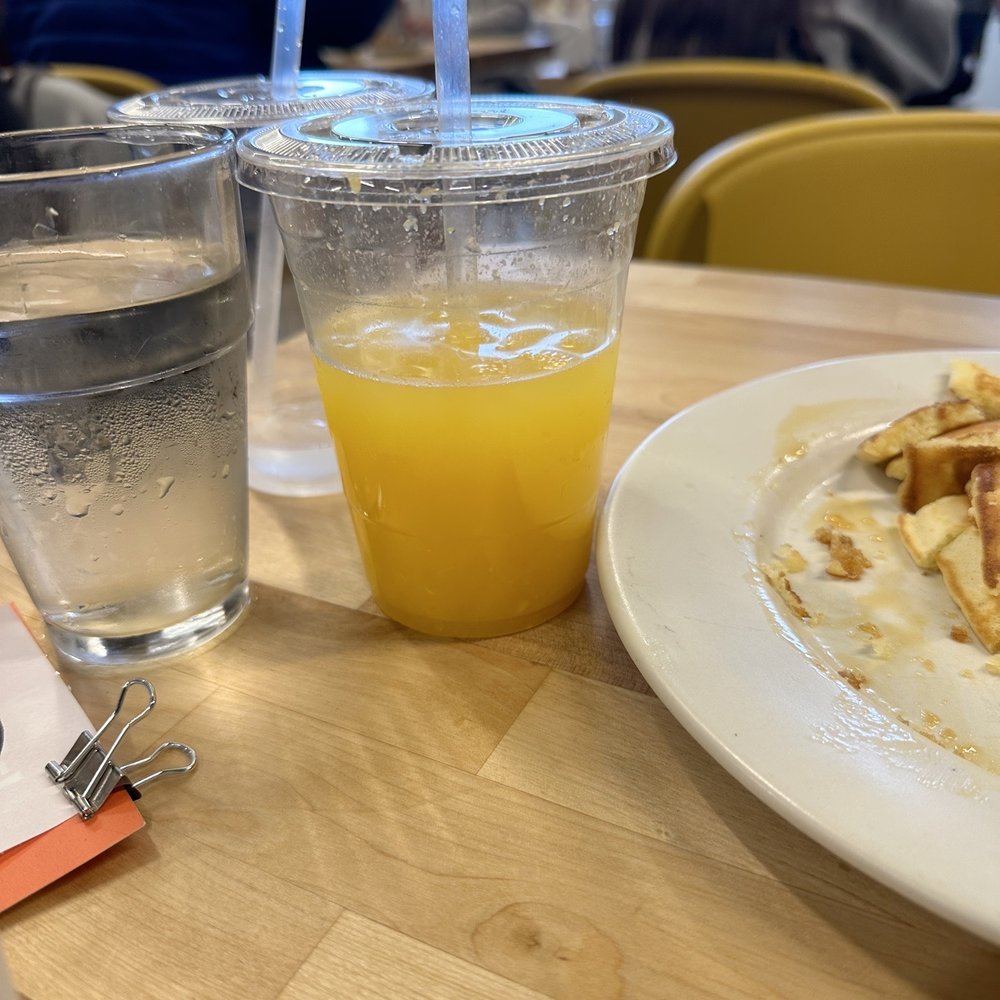 Matt's Big Breakfast Gilbert - Orange juice, fresh squeeze but less than half the plastic cup. Shown in image has water added because my kid didn't like all the pulp. - Breakfast & Brunch Near Me - Gilbert, Arizona