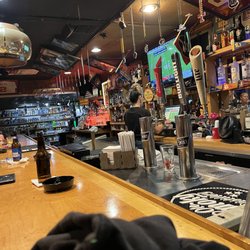 FLIGHT 747 LOUNGE - Bar with a sneak peek to the liquor store attached at the end :)