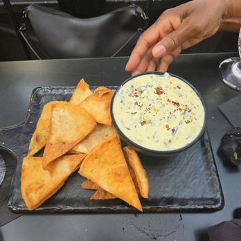 Nafsi - Spinach, artichoke, and collard green dip with pita chips - New American Near Me - Chicago, Illinois Nafsi - Spinach, artichoke, and collard green dip with pita chips - New American Near Me - Chicago, Illinois