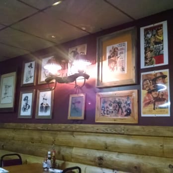 Club 4 Corners - a wall of framed photos - American Near Me - Scranton, Kansas