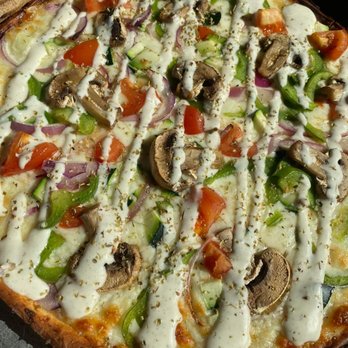 Crave Restaurant - a pizza with vegetables and cheese - Pizza Near Me - Martin, Tennessee Crave Restaurant - a pizza with vegetables and cheese - Pizza Near Me - Martin, Tennessee
