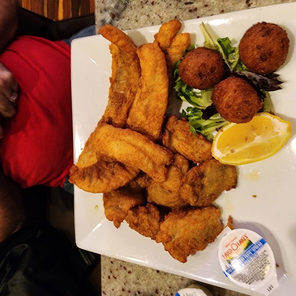 Pirate's Cove Restaurant - Fried pollock, fried oysters and baked potatoe with hushpuppies - Seafood Near Me - Chesapeake, Virginia Pirate's Cove Restaurant - Fried pollock, fried oysters and baked potatoe with hushpuppies - Seafood Near Me - Chesapeake, Virginia
