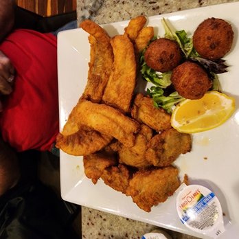 Pirate's Cove Restaurant - Fried pollock, fried oysters and baked potatoe with hushpuppies - Seafood Near Me - Chesapeake, Virginia Pirate's Cove Restaurant - Fried pollock, fried oysters and baked potatoe with hushpuppies - Seafood Near Me - Chesapeake, Virginia