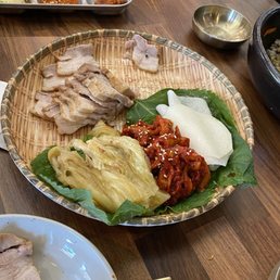 A pork wrap! Wrap in cabbage, Korean radishes, and spicy veggies A pork wrap! Wrap in cabbage, Korean radishes, and spicy veggies