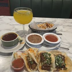 La Tropicana Mexican Market - Birria tacos,, chips, beans & salsa, mango margarita.