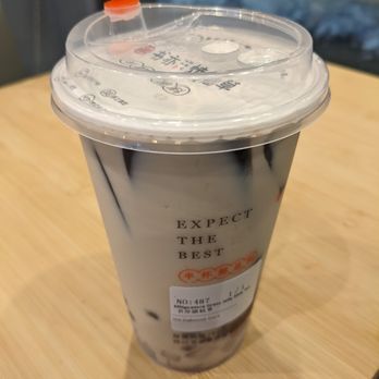 Shuyi Tealicious - a cup of coffee on a table - Bubble Tea Near Me - Ottawa, Ontario