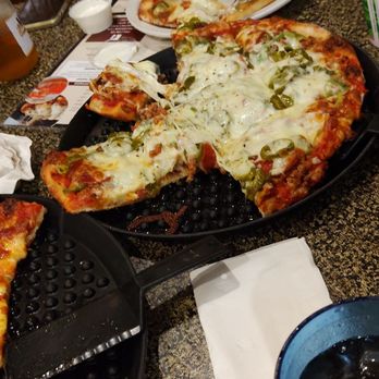 Langel's Pizza - a pizza with a slice missing - Pizza Near Me - Highland, Indiana Langel's Pizza - a pizza with a slice missing - Pizza Near Me - Highland, Indiana