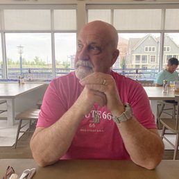 a man sitting at a table a man sitting at a table