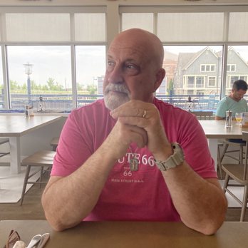 The Beacon Restaurant & Bar - a man sitting at a table - New American Near Me - Port Washington, Wisconsin The Beacon Restaurant & Bar - a man sitting at a table - New American Near Me - Port Washington, Wisconsin
