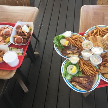 Key Largo Fisheries - 2018 Mahi Sandwich peal and eat shrimp; grouper fingers Conch Fritters , calamari, sandwiches. - Seafood Near Me - Key Largo, Florida Key Largo Fisheries - 2018 Mahi Sandwich peal and eat shrimp; grouper fingers Conch Fritters , calamari, sandwiches. - Seafood Near Me - Key Largo, Florida