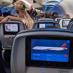 Delta Air Lines - Inside an Airbus A320-200. View from seat 25E.