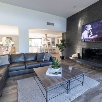 Todd Whittaker Drywall - Cultured stone panels from floor to ceiling give this Family Room a whole new modernized and masculine look. - General Contractors Near Me - Phoenix, Arizona