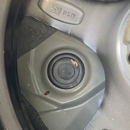 In the trunk under the tire.
