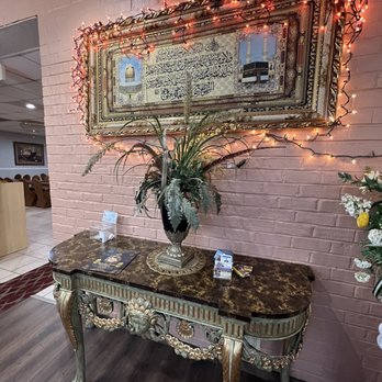 Zamzam Kabobs House - a table with a vase of flowers - Afghan Near Me - Manassas, Virginia