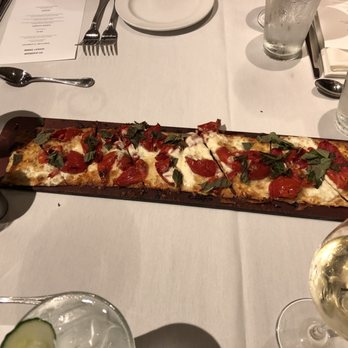 Seasons 52 - Roasted tomato, mozzarella, Parmesan, basil flatbread pizza - New American Near Me - Houston, Texas