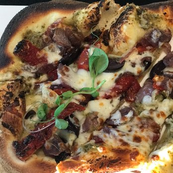 Broadmoor Bistro - Hand tossed pizza w pistachio pesto, prosciutto, salami, sun dried tomato, olives.... - New American Near Me - Overland Park, Kansas Broadmoor Bistro - Hand tossed pizza w pistachio pesto, prosciutto, salami, sun dried tomato, olives.... - New American Near Me - Overland Park, Kansas