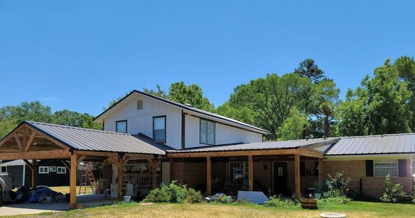 ETX Roofing and Construction Logo