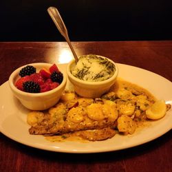 Crescent City Grill - Blackened Catch Orleans with fruit and creamed spinach.