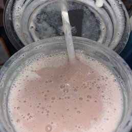 a smoothie in a plastic cup a smoothie in a plastic cup