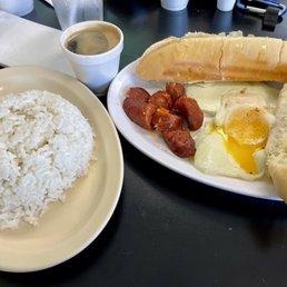 Espresso, eggs, chorizo, toast and white rice. Espresso, eggs, chorizo, toast and white rice.
