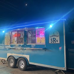 Taco trucks located in discount mart gas station parking lot