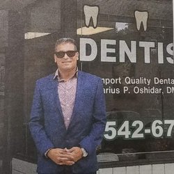 Oceanport Quality Dental Care - Owner pictured in front of dental office.