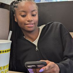 KeniaKreations - Waist length knotless braids pulled up in a ponytail