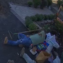 two people laying on the ground