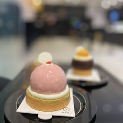 Yu Cake - Strawberry matcha french mousse cake. Coconut mango french mousse in the back.
