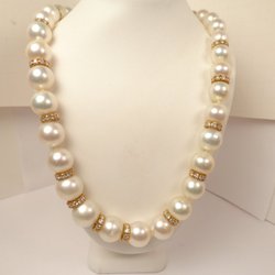 H Horwitz Jewelers - 10-12 mm golden south sea and diamond rondel diamond separators. Call 312-337-3500 for details and presentation. hhorwitz.com