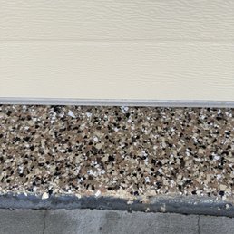 The garage door and the edge of the floor. The garage door and the edge of the floor.