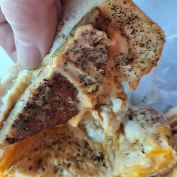 Superior - a hand holding a half eaten sandwich - Bagels Near Me - Deer Park, New York Superior - a hand holding a half eaten sandwich - Bagels Near Me - Deer Park, New York