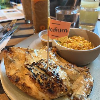 Nando's Peri-Peri - 1/4 Peri Peri chicken breast, with a side of Portuguese rice - Chicken Shop Near Me - Dunwoody, Georgia Nando's Peri-Peri - 1/4 Peri Peri chicken breast, with a side of Portuguese rice - Chicken Shop Near Me - Dunwoody, Georgia