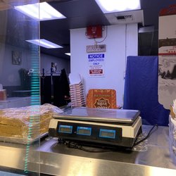 Mother India Cuisine - Notice behind counter