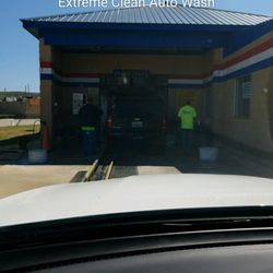 Extreme Clean Auto Wash - Two men pre-clean your car before you go through the car wash. Nice!