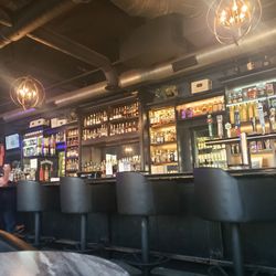 Stogeez Cigar Lounge - Just half the bar, eight more seats to the left and the walk in humidor is to the left as well.
