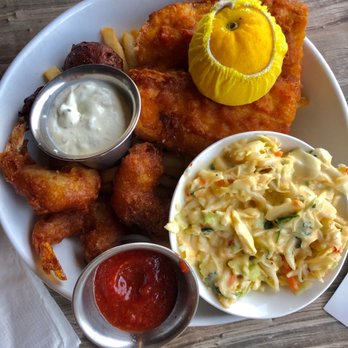 Skipper's Dockside - The fish platter with conch fritters, fried shrimp, fried fish, and mango coleslaw. - Seafood Near Me - Key Largo, Florida Skipper's Dockside - The fish platter with conch fritters, fried shrimp, fried fish, and mango coleslaw. - Seafood Near Me - Key Largo, Florida