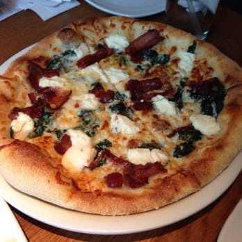 California Pizza Kitchen - White pizza with bacon. Pretty good, but crust gets hard and chewy when cold. - Pizza Near Me - Troy, Michigan California Pizza Kitchen - White pizza with bacon. Pretty good, but crust gets hard and chewy when cold. - Pizza Near Me - Troy, Michigan