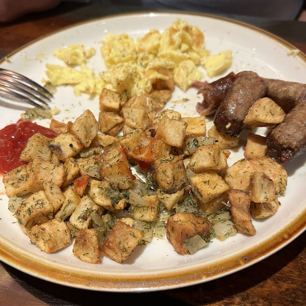 Opry Backstage Grill - Eggs potatoes and undercooked sausage links. - American Near Me - Nashville, Tennessee Opry Backstage Grill - Eggs potatoes and undercooked sausage links. - American Near Me - Nashville, Tennessee