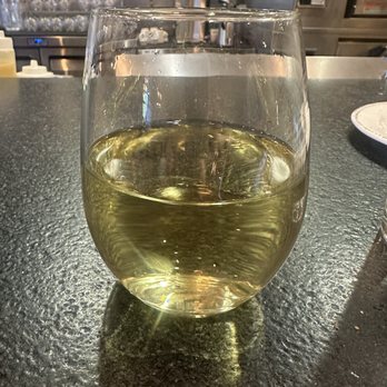 RANGE kitchen & tap - Happy hour Chardonnay is amazing. Great pour too! - New American Near Me - Roseville, California RANGE kitchen & tap - Happy hour Chardonnay is amazing. Great pour too! - New American Near Me - Roseville, California