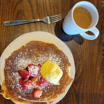 First Watch - Lemon curd pancakes.  Fluffy & soft & tangy. The lemon curd & strawberries make this meal. - Breakfast & Brunch Near Me - Orlando, Florida