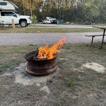 Western Woods Campground - Enjoying a fire in their fire rings that they provide ! - RV Parks Near Me - Wisconsin Dells, Wisconsin