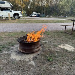 Enjoying a fire in their fire rings that they provide !