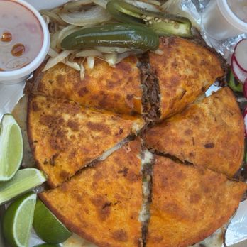 Tito’s Tacos - Large birria pizza - Food Trucks Near Me - Lubbock, Texas Tito’s Tacos - Large birria pizza - Food Trucks Near Me - Lubbock, Texas