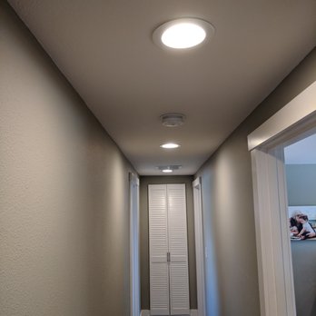Panel Pros Electric - Newly installed recessed lighting down a hallway. - Electricians Near Me - Kent, Washington Panel Pros Electric - Newly installed recessed lighting down a hallway. - Electricians Near Me - Kent, Washington